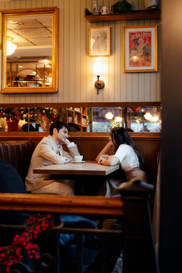 our-services-2 A couple enjoying a warm and cozy date at a cafe in Vancouver, capturing a lovely ambiance.